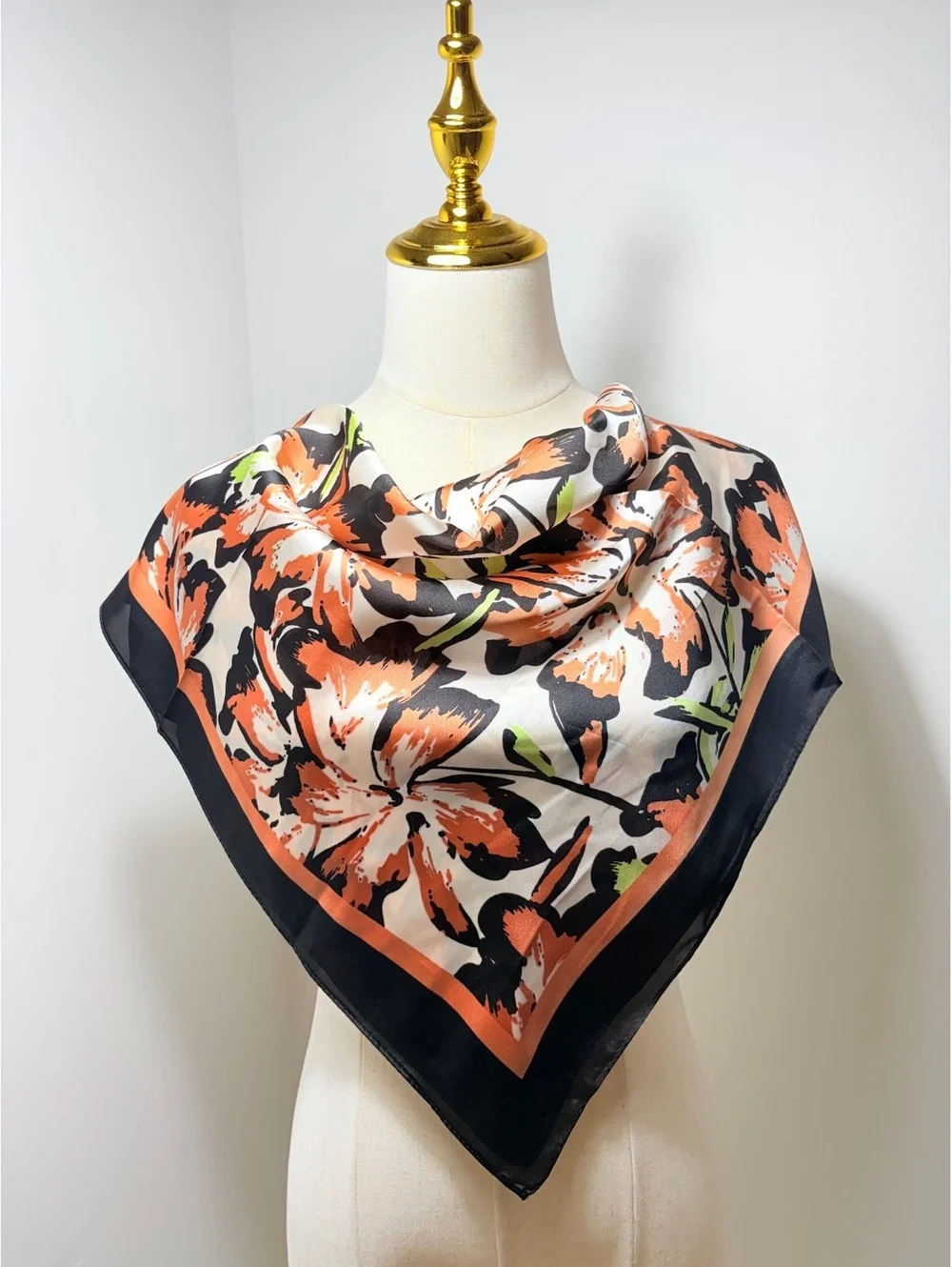 Elegant Floral Patterned Scarf with Black and Orange Border